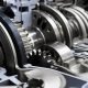 Gearbox cross-section, automotive transmission with sprocket and bearing mechanism for commercial trucks, SUV, cargo, and construction vehicles, selective focus